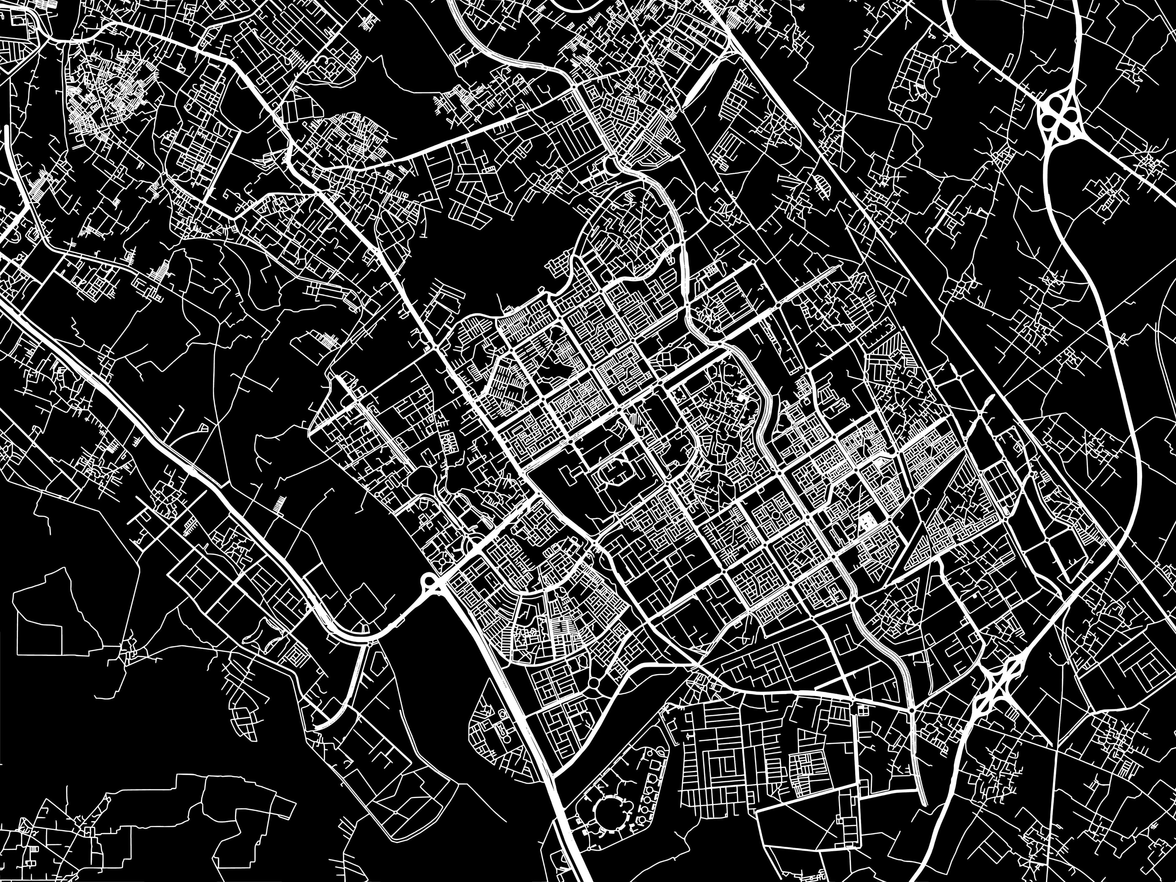 A high-contrast, stylized black-and-white street map of Greater Noida, highlighting the city's densely planned geometric grid network of local roads, sector divisions, and major highway intersections