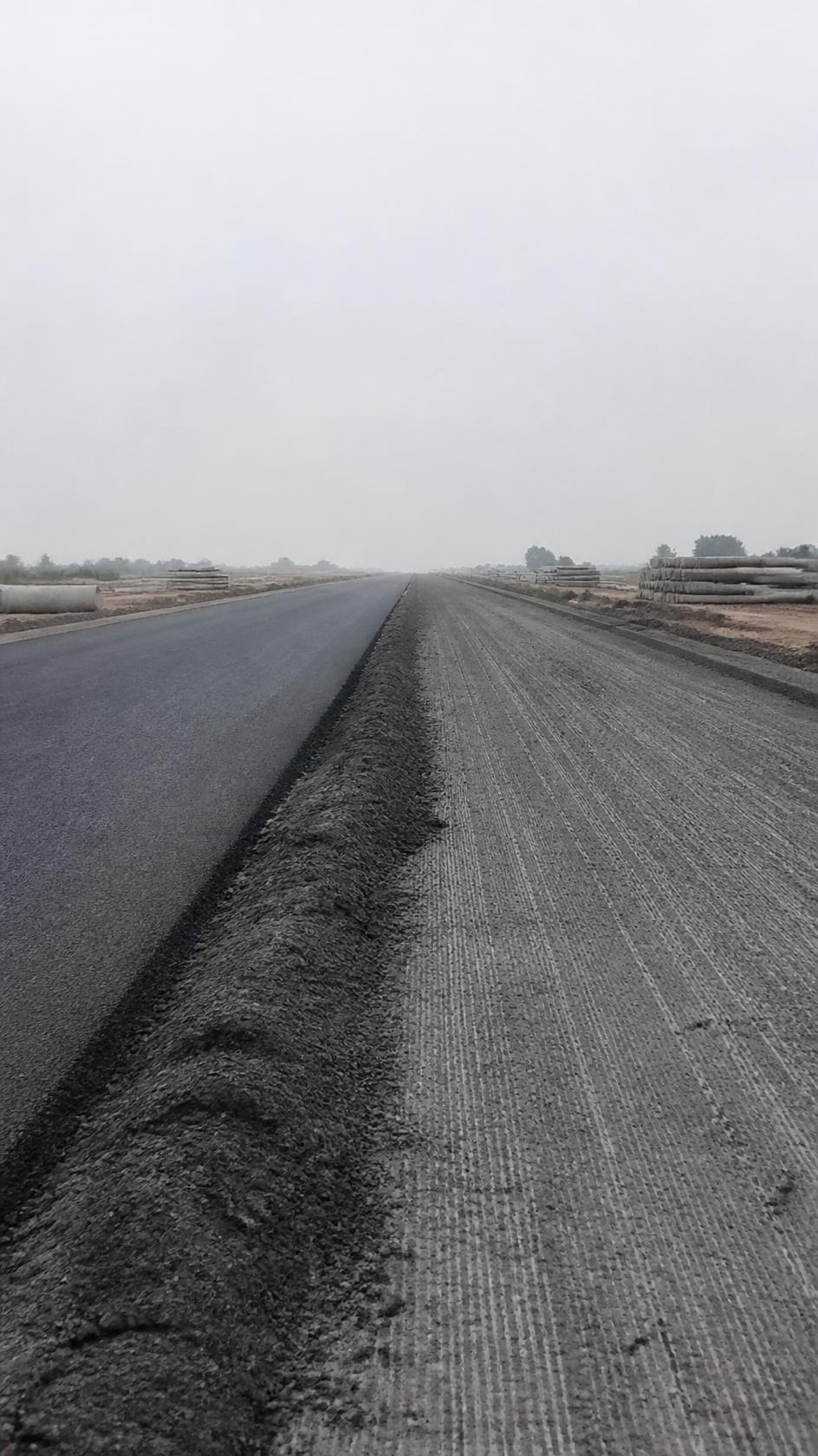 Milled carriageway lane alongside a newly overlaid lane on a national highway